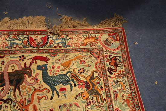 An early 20th century Kirman hunting rug, 6ft 5in by 4ft 2in.